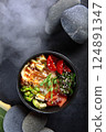 Poke salad with salmon. Delicious and hearty dish with red fish. Natural omega. Flat lay. Top view. Copy space. 124891347