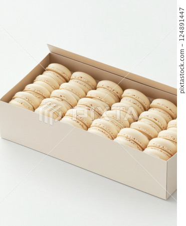 Box of white macarons arranged neatly in elegant packaging, suitable for background 124891447