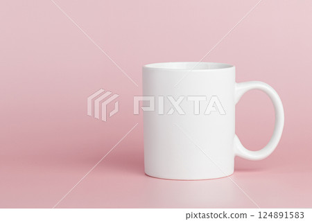 white cup for tea or coffee on a pink background white cup for tea or coffee on a pink background 124891583
