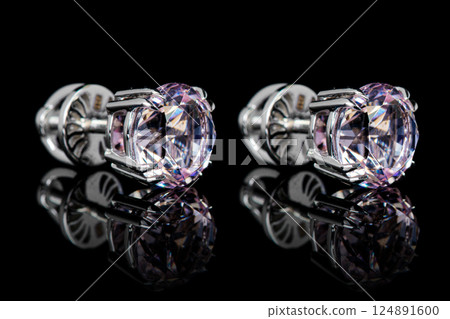 earrings silver, gold with stone morganite, diamonds on black background earrings silver, gold with stone morganite, diamonds on black background 124891600
