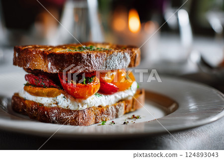 Gourmet sandwich with roasted vegetables and soft cheese 124893043