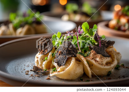 Gourmet pasta with truffle shavings and microgreens 124893044