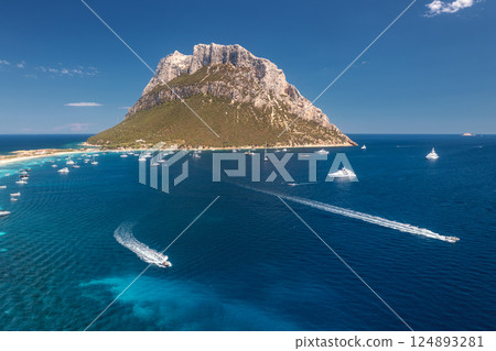 Aerial view of luxury yachts and floating speed boats on blue sea 124893281