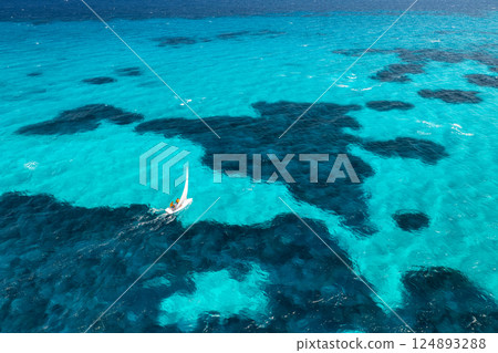 Aerial view of sailboat on blue sea on summer sunny day. Travel 124893288