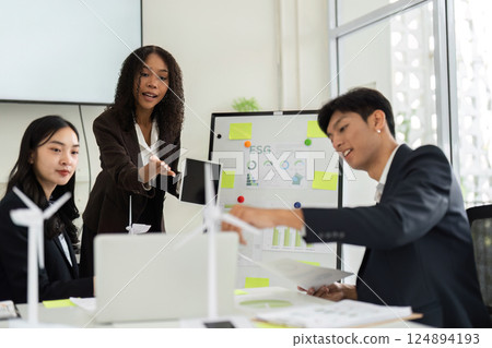 Collaborative ESG Discussion in a Corporate Environment. A team engages in brainstorming innovative solutions for sustainable practices. 124894193