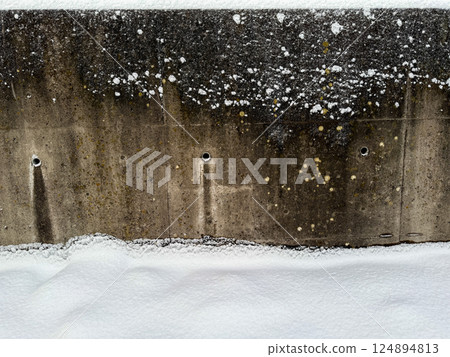 Snow covered concrete wall texture 124894813