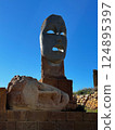 Modern symbolic statue faces at Teatro Andromeda in Sicily. 124895397