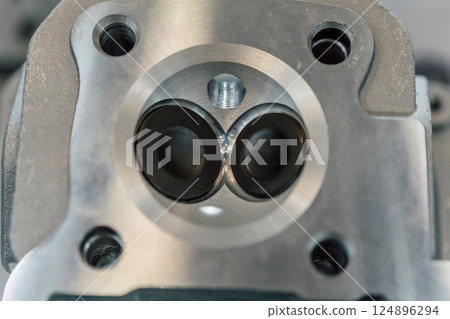 gasoline combustion chamber on a motorcycle. valve cover on a scooter gasoline combustion chamber on a motorcycle. valve cover on a scooter 124896294