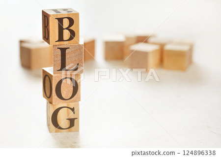 Four wooden cubes arranged in stack with word BLOG on them, space for text / image at down right corner Four wooden cubes arranged in stack with word BLOG on them, space for text / image at down right corner 124896338