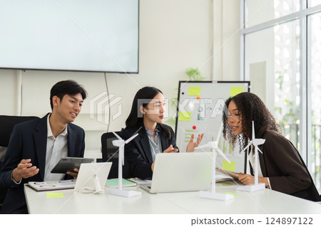 Collaborative ESG Strategy Discussion. Team members evaluate sustainable practices and strategies in a modern office. Collaborative ESG Strategy Discussion. Team members evaluate sustainable practices and strategies in a modern office. 124897122