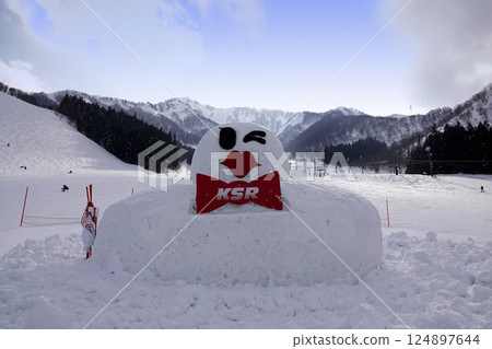 A big snowman on the slopes of a ski resort 124897644