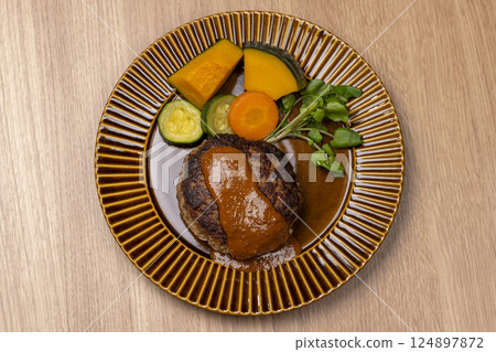 Aerial view of a plate of handmade hamburger steak and colorful vegetables 124897872
