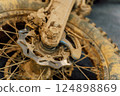 dirty off-road enduro motorcycle wheel. dirt motorcycle tire from off-road racing 124898869