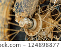 dirty off-road enduro motorcycle wheel. dirt motorcycle tire from off-road racing 124898877