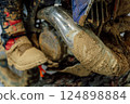 dirty muffler on a mountain bike. scooter exhaust system after mud racing 124898884