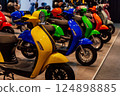 small-capacity scooters at a motorcycle exhibition. colorful scooters for the stand 124898885