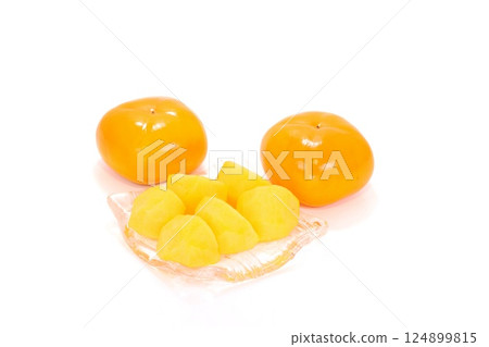 Okesa persimmon, persimmon cut, dessert, light background Okesa persimmon, persimmon cut, dessert, light background 124899815