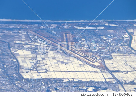 The sky above Sendai Airport in winter, covered in snow 124900462