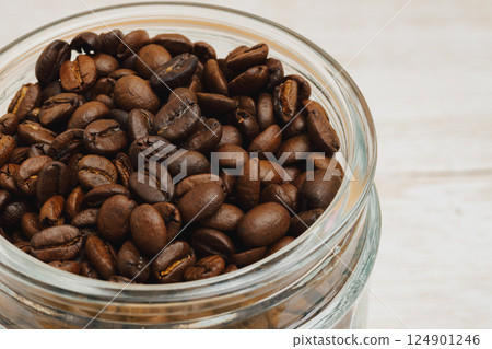 Coffee beans in a glass jar 124901246