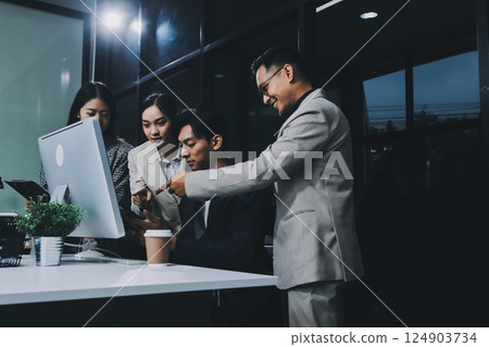 Cheerful meeting room, businesspeople celebrate with handshaking. Successful project was completed before the deadline. Business partnership and collaboration in project management. Habiliment Cheerful meeting room, businesspeople celebrate with handshaking. Successful project was completed before the deadline. Business partnership and collaboration in project management. Habiliment 124903734