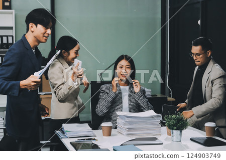 Business team showing unity with their hands together, Close up top view of young business people putting their hands together. people together to work as team to ensure the success of the business 124903749