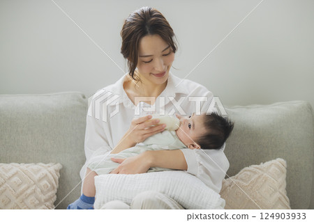 A family relaxing in the living room A family relaxing in the living room 124903933