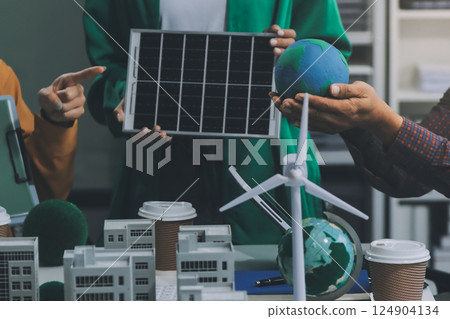 Asian business people team brainstorm meeting in green corporate office. Presentation ESG project planning. Environmental conservation, responsible business, sustainable development goal concept 124904134