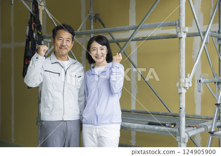 Couple working at a construction site Couple working at a construction site 124905900
