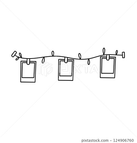 A string of lights with three picture frames hanging from it 124906760
