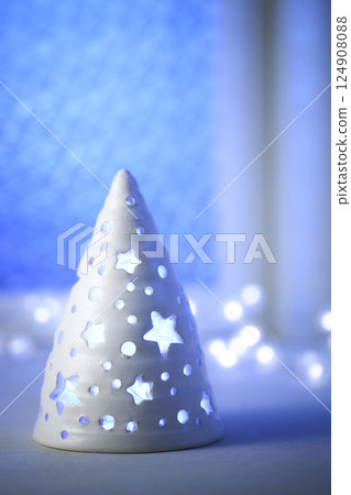 Christmas tree decorated by the window Christmas image 124908088