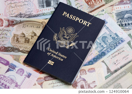 American passport on a Afghan money 124910064
