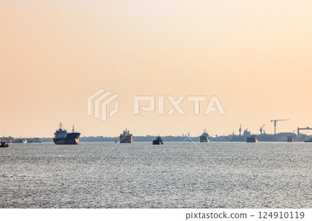 Panorama view of ocean liner, Cargo Ship, Thanker going to port in Thai gulf zone near Samutprakarn province, Thailand. Panorama view of ocean liner, Cargo Ship, Thanker going to port in Thai gulf zone near Samutprakarn province, Thailand. 124910119