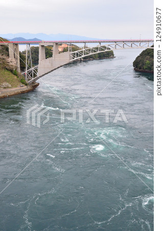 Cherry blossoms, the Nishikai Bridge, and the whirlpools of Inoura Strait 124910677