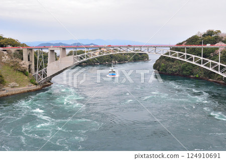 Cherry blossoms, the Nishikai Bridge, and the whirlpools of Inoura Strait 124910691