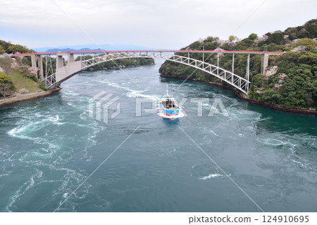 Cherry blossoms, the Nishikai Bridge, and the whirlpools of Inoura Strait 124910695