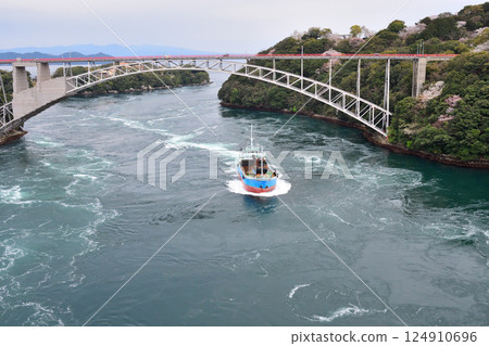 Cherry blossoms, the Nishikai Bridge, and the whirlpools of Inoura Strait 124910696