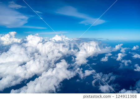 Aerial view of fluffy clouds over the Pacific Ocean in Polynesia Aerial view of fluffy clouds over the Pacific Ocean in Polynesia 124911308