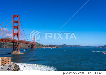 Golden Gate Bridge over blue waters with scenic hills in San Francisco 124911329