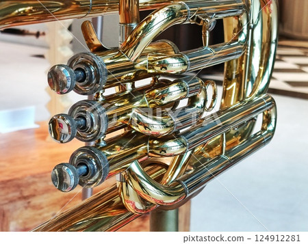 Close-up of a shiny golden trumpet. 124912281