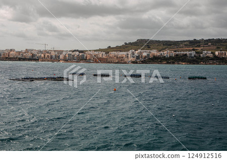 Coastal Fish Farms in Mellieha Bay, Malta Under Moody Skies 124912516