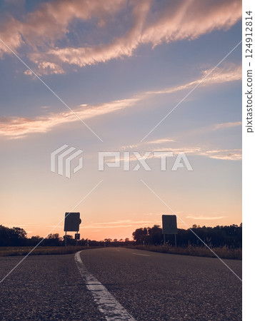 Road with two large billboards on either side Road with two large billboards on either side 124912814