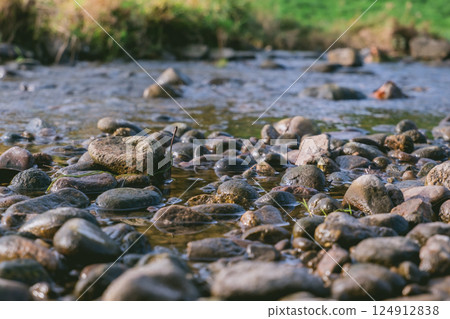 River with a lot of rocks in it 124912838
