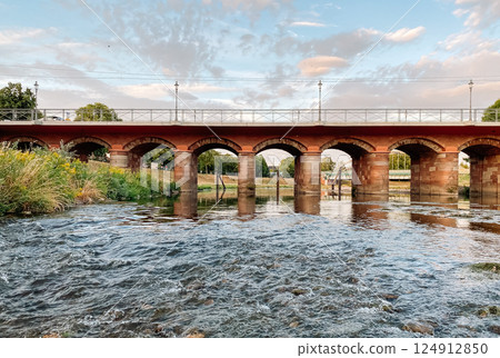 Bridge spans a river with a view of the water below Bridge spans a river with a view of the water below 124912850