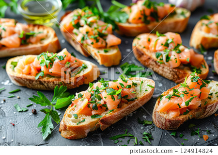 Plate of bread with salmon and parsley on top 124914824