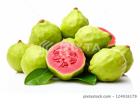 Pile of green guavas with one of them cut open 124916179