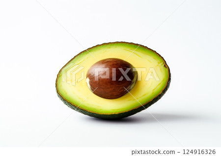 Large avocado is cut in half and placed on a white background. Large avocado is cut in half and placed on a white background. 124916326
