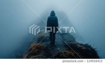 Person is walking on a path in the fog Person is walking on a path in the fog 124916415