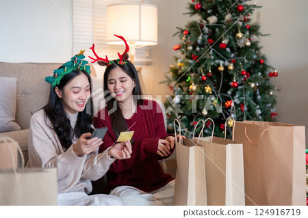 Festive Online Shopping with Lesbian Asian Couple 124916719