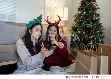 Lesbian Couple Reviewing Festive Shopping List A Balance of Fun and Financial Prudence Lesbian Couple Reviewing Festive Shopping List A Balance of Fun and Financial Prudence 124917005