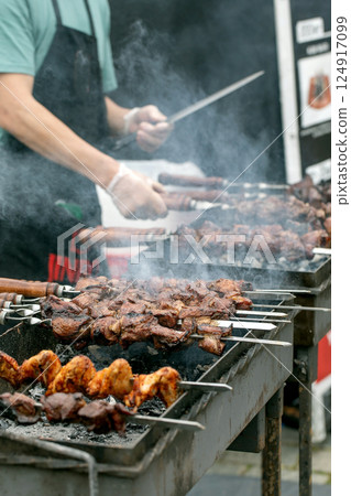 Chef Grilling Meat Skewers Street Food 124917099
